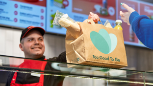 a Circle K Employee hands over a Surprise bag