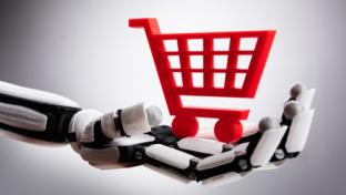 Close-up Of A Robotic Hand Holding Red Shopping Cart On Gray Background